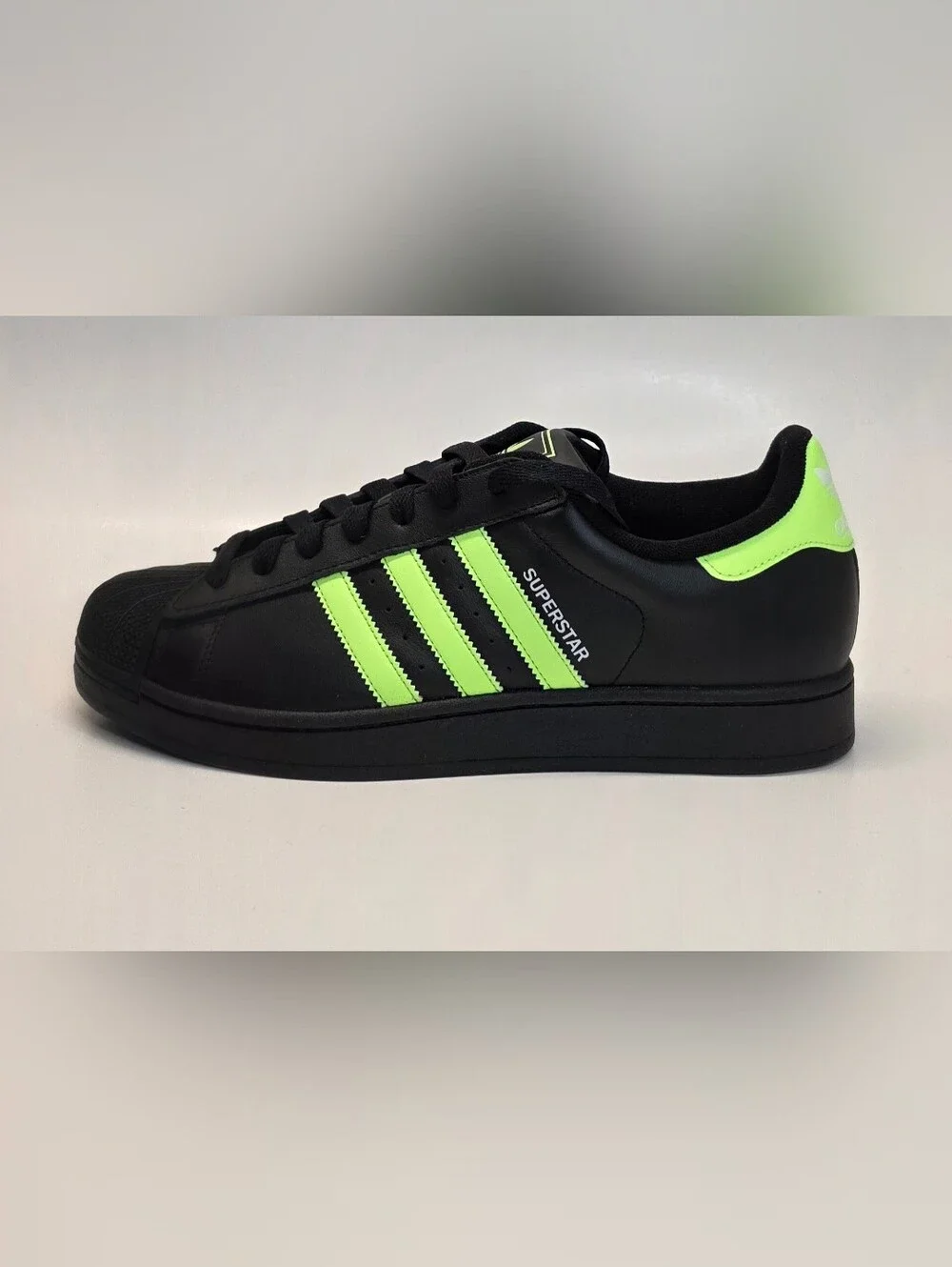 adidas Men’s Black Sneakers with Neon Green Stripes